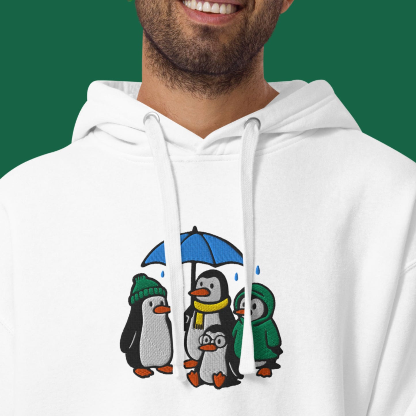 Pinguin-Familie im Regen – Bestickter Unisex-Hoodie